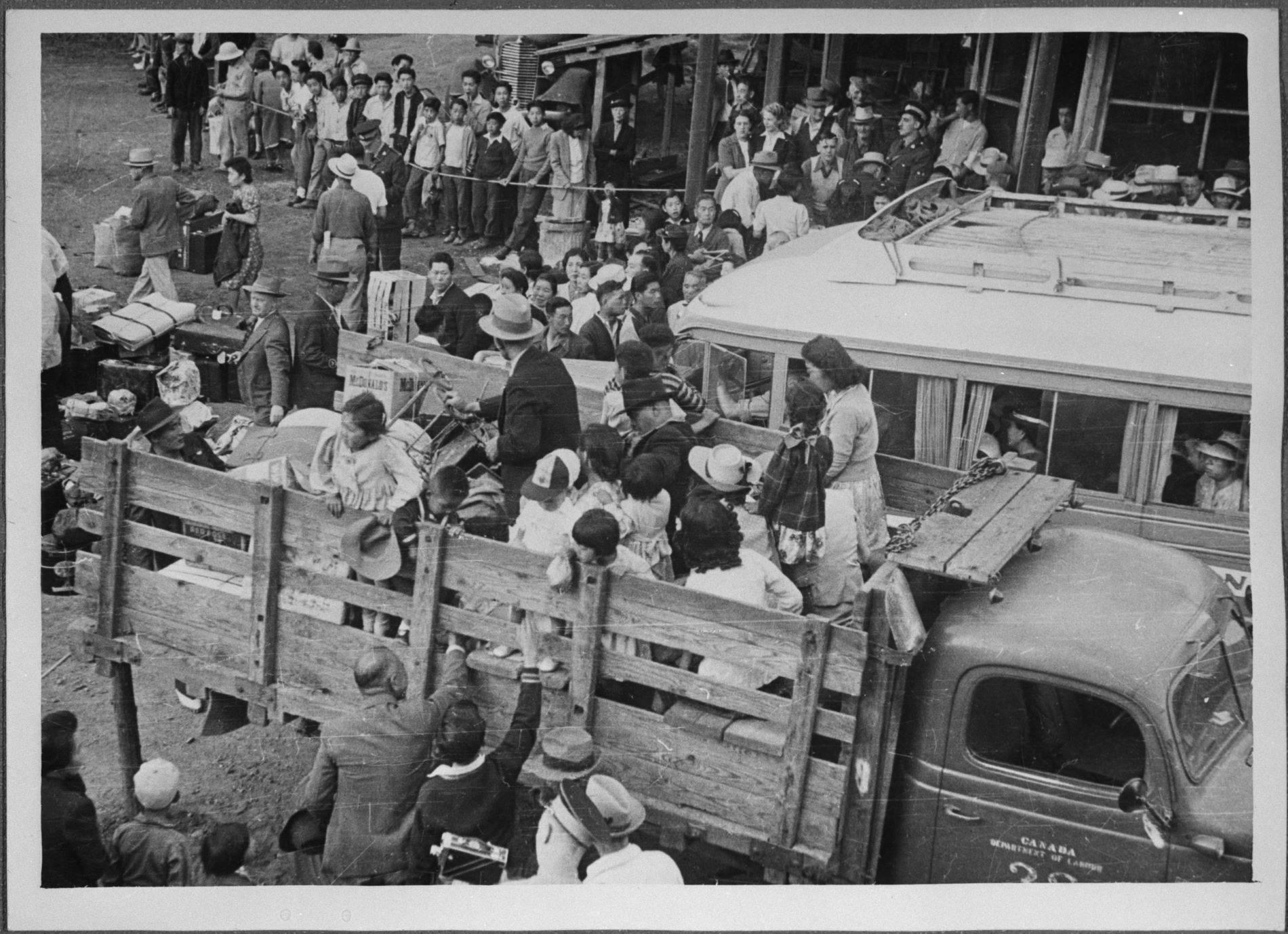 Group of Japanese Canadians being transported to camp at Slocan, British Columbia, 1942 / Photo: Tak Toyota Library and Archives Canada, C-046350