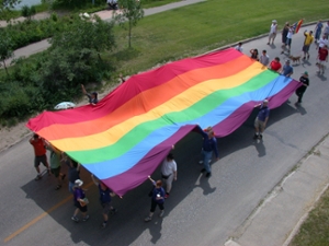 The Pride on the Prairies exhibit explores queer history in Saskatchewan. (Image: Rainbow flag at Saskatoon Pride, via University of Saskatchewan Archives and Special Collections, early 2000s)
