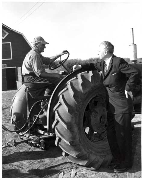 John Diefenbaker chatting with a farmer