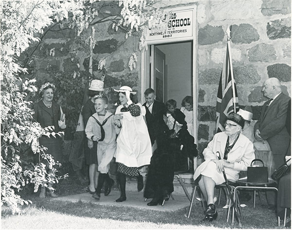 Children exiting the Little Stone Schoolhouse at the Official Re-Opening in 1967. Saskatoon Public Library LH-1175.
