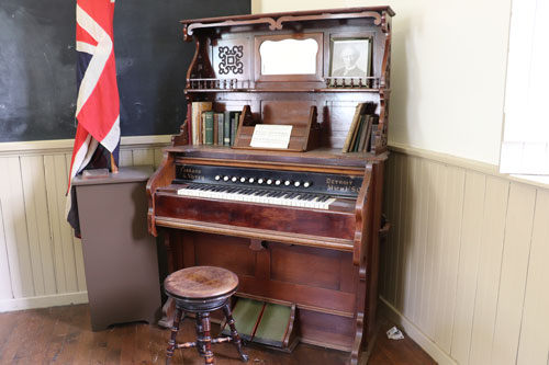 The pump organ that still resides at the Little Stone Schoolhouse today.