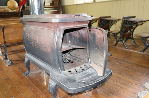 The iron stove, which heated the school by burning wood logs, at the Little Stone Schoolhouse today.