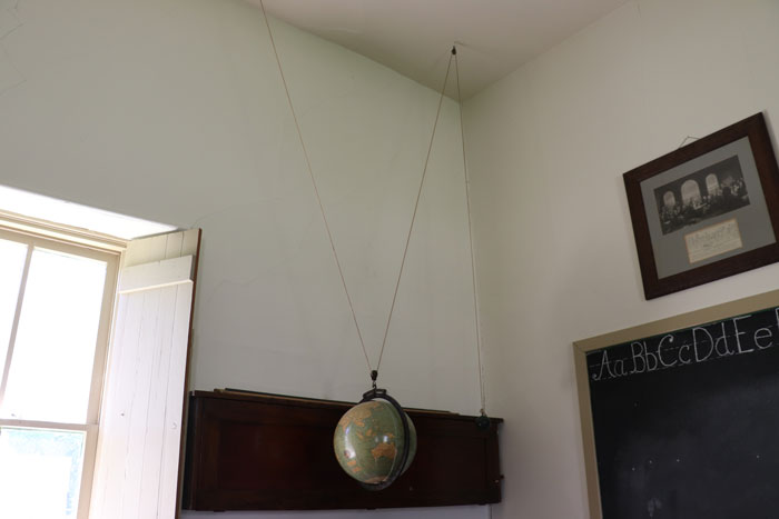 The hanging globe at the Little Stone Schoolhouse today