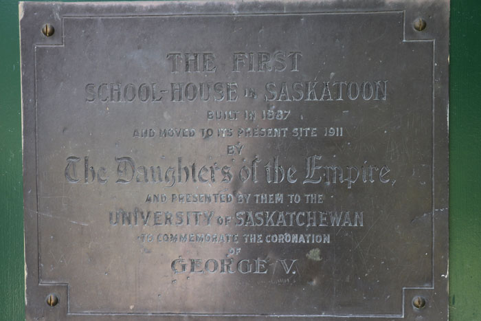 The original plaque, which is still on the door to the Little Stone Schoolhouse today