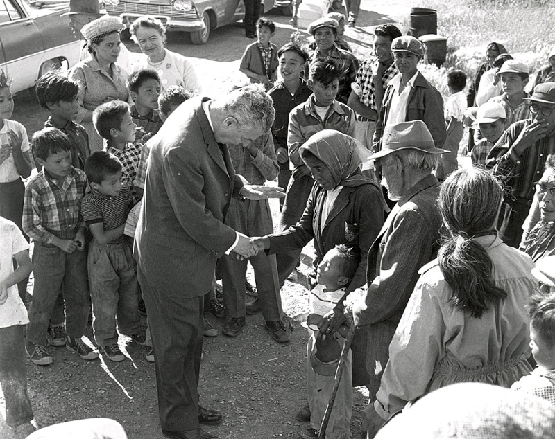 John Diefenbaker greeting an Aboriginal woman, and a small boy