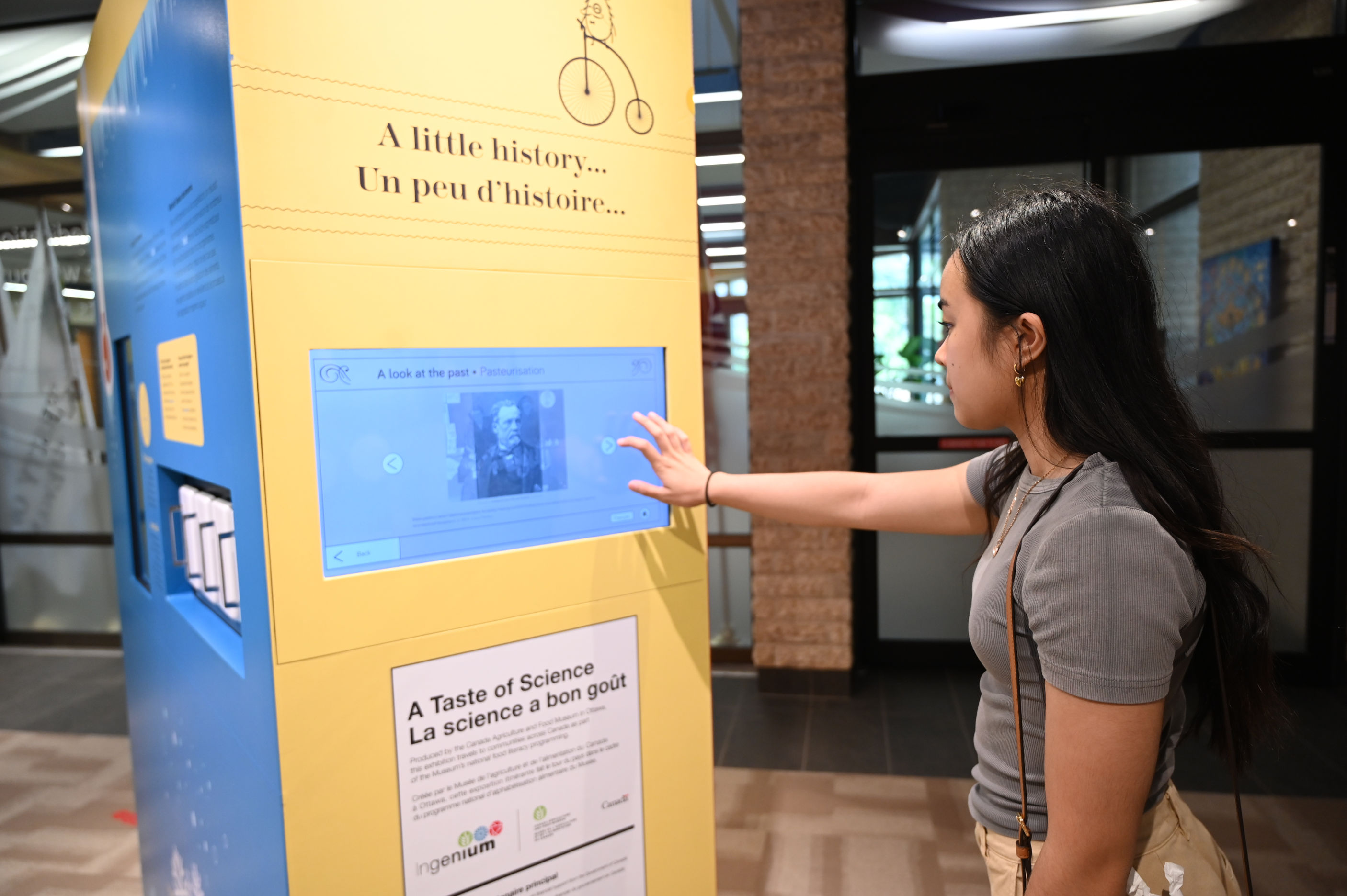 Girl looking at taste of science exhibit